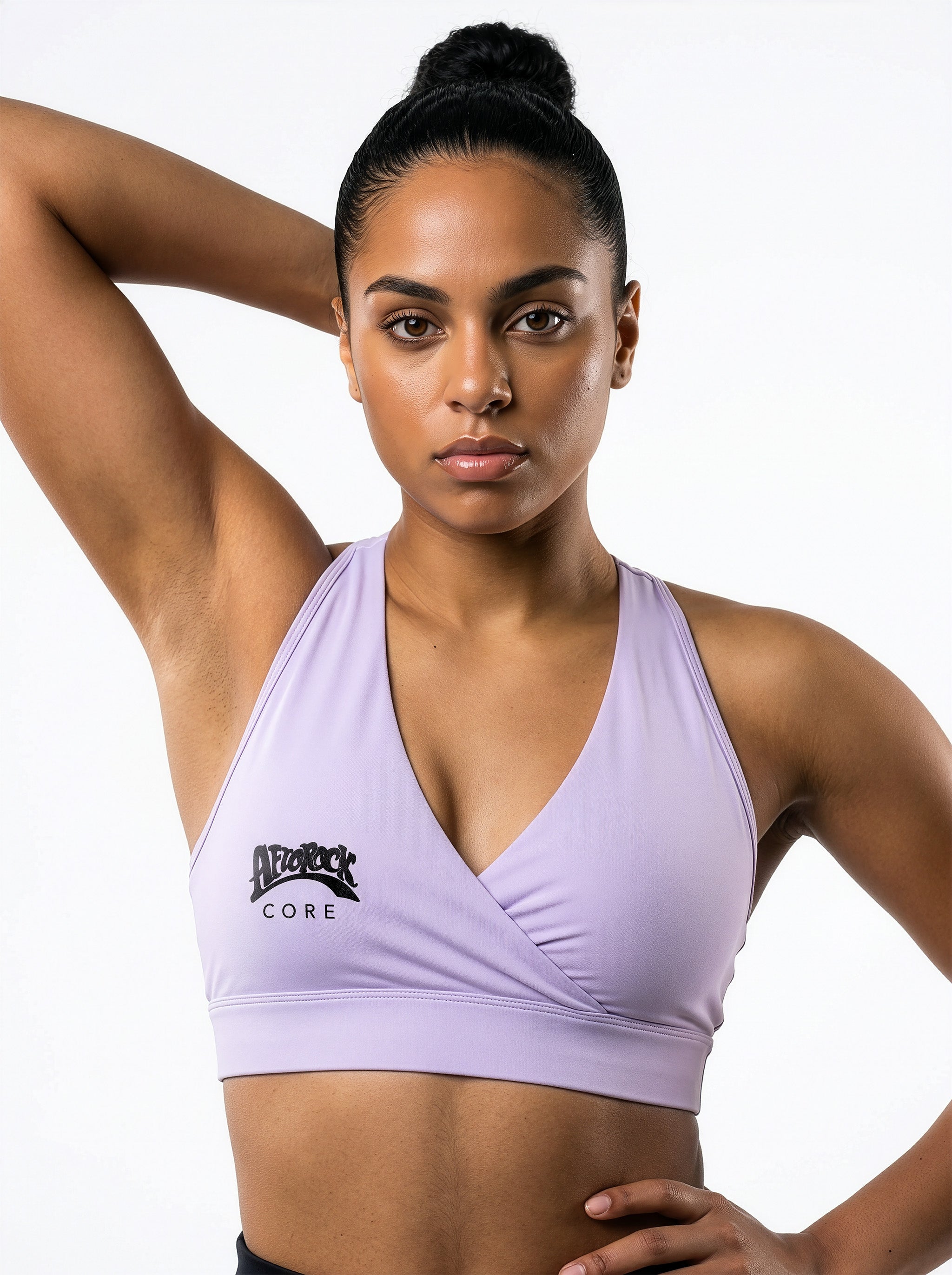 Model Kayla wearing the AfroRock Core Crossover Sports Bra Lavender Purple. Premium streetwear-inspire Purple activewear designed for performance and style.⁠