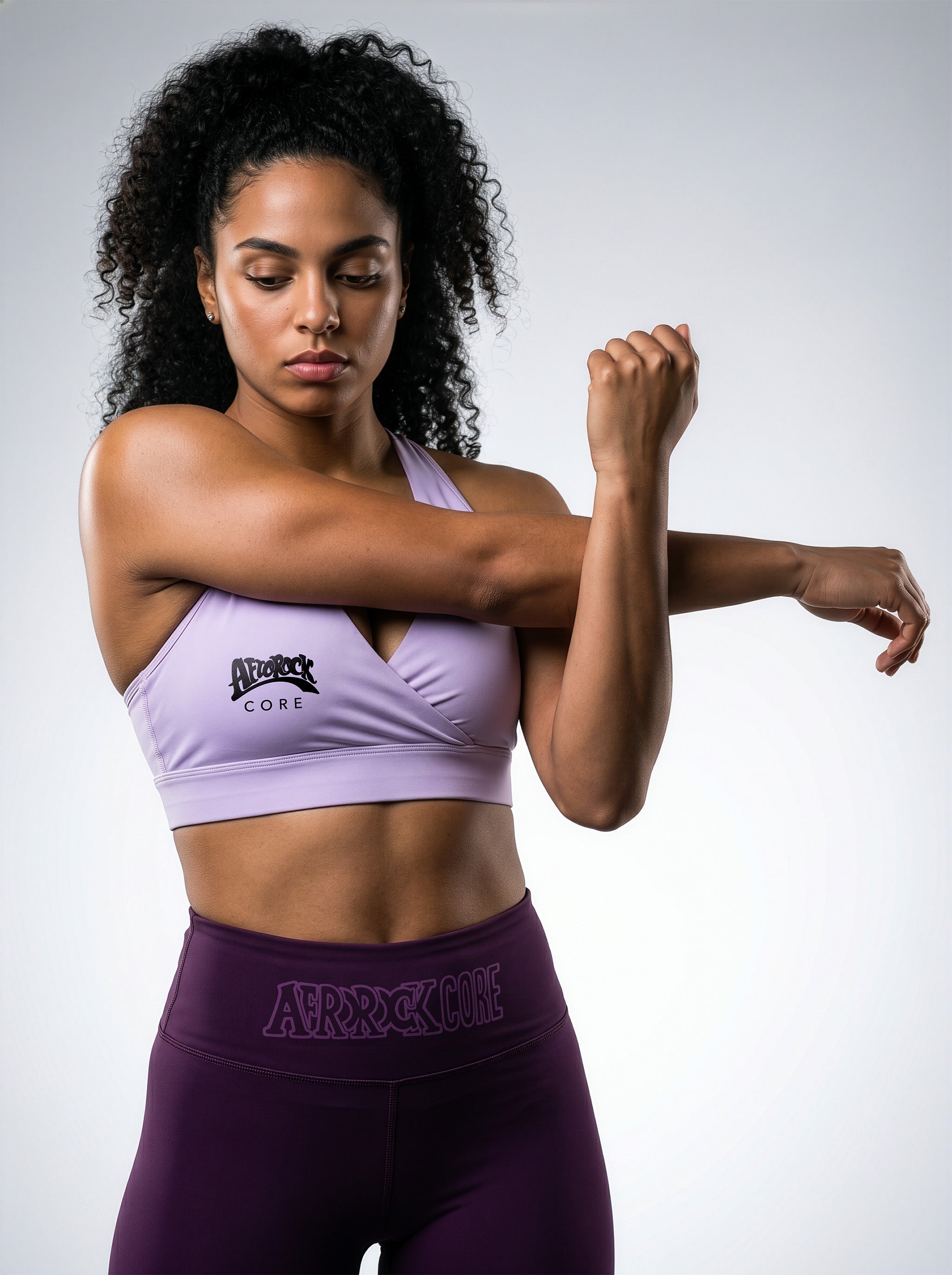 Model Kayla wearing the AfroRock Core high-waisted Purple yoga leggings and Purple sports bra. Premium streetwear-inspire Purple activewear designed for performance and style.⁠