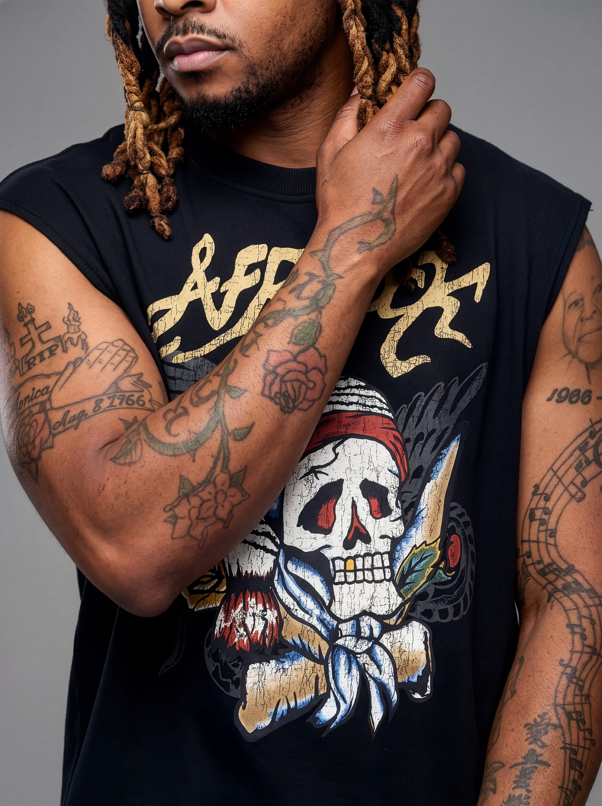 Front detail view of Kal AfroRock wearing the signature Mazi Skull Horns Boxy Tank. This premium streetwear piece features original hand-drawn artwork with a unique crackle effect and bold AfroRock branding.⁠
