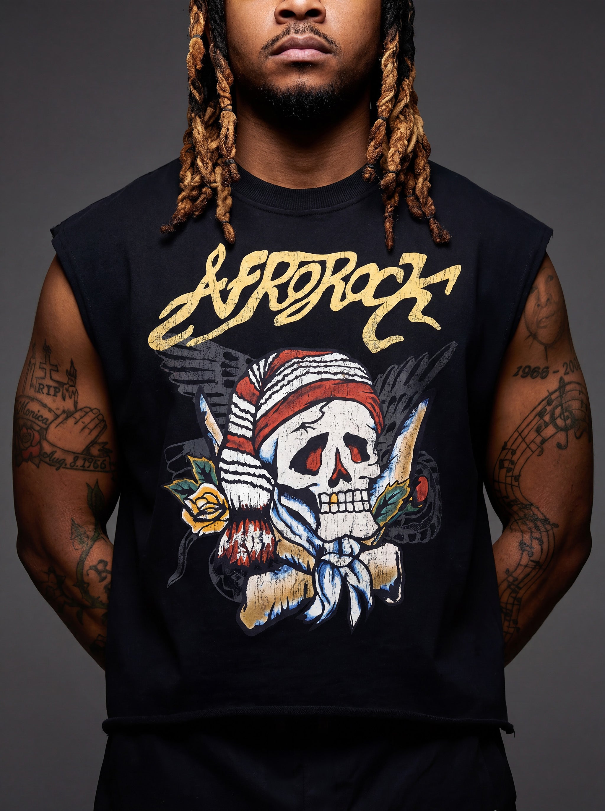 Front detail view of Kal AfroRock wearing the signature Mazi Skull Horns Boxy Tank. This premium streetwear piece features original hand-drawn artwork with a unique crackle effect and bold AfroRock branding.⁠