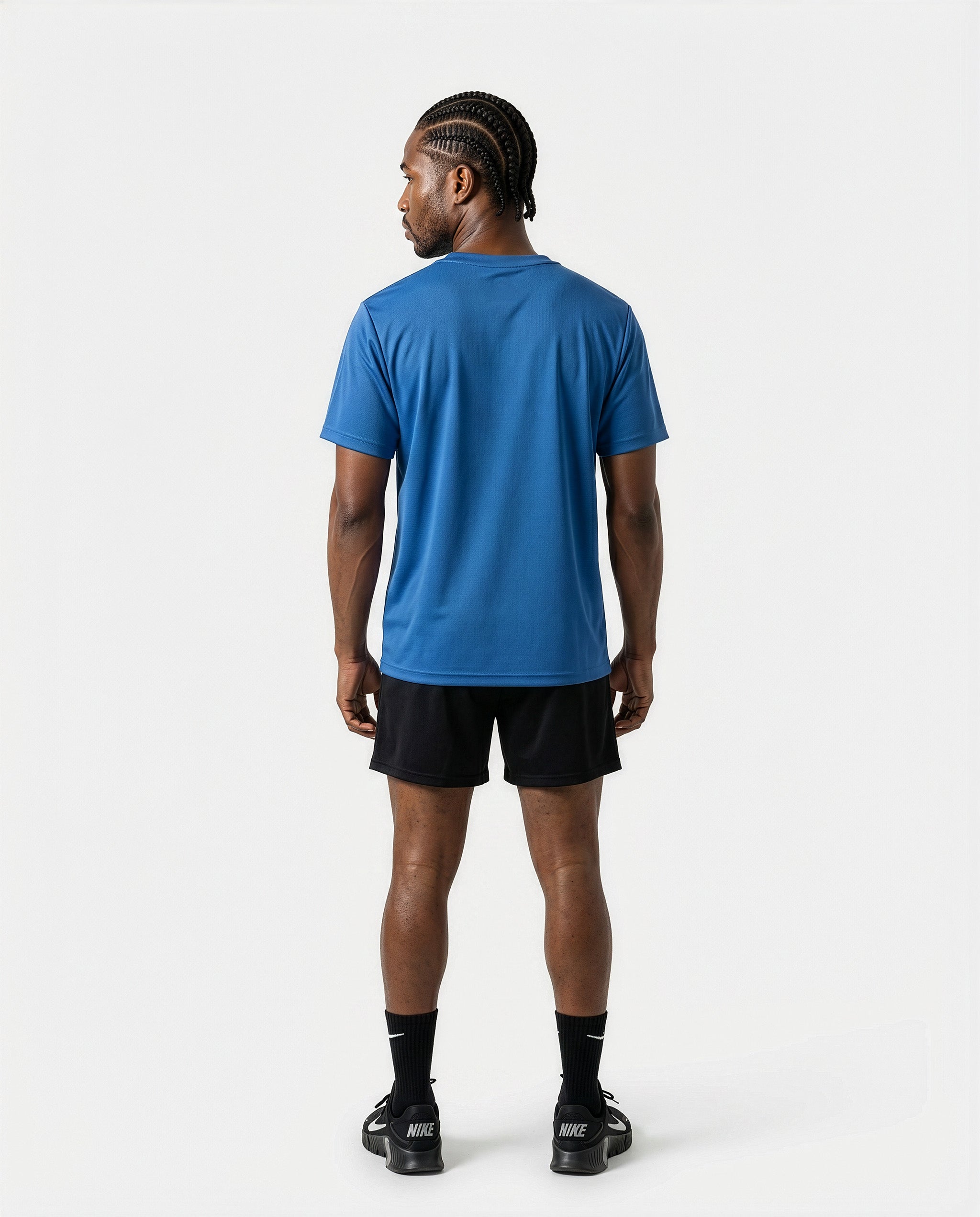 Full Rear view of the AfroRock Core Performance T-Shirt and Black Activewear Shorts on model Michael, showcasing the premium athletic fit and back branding details.⁠ 