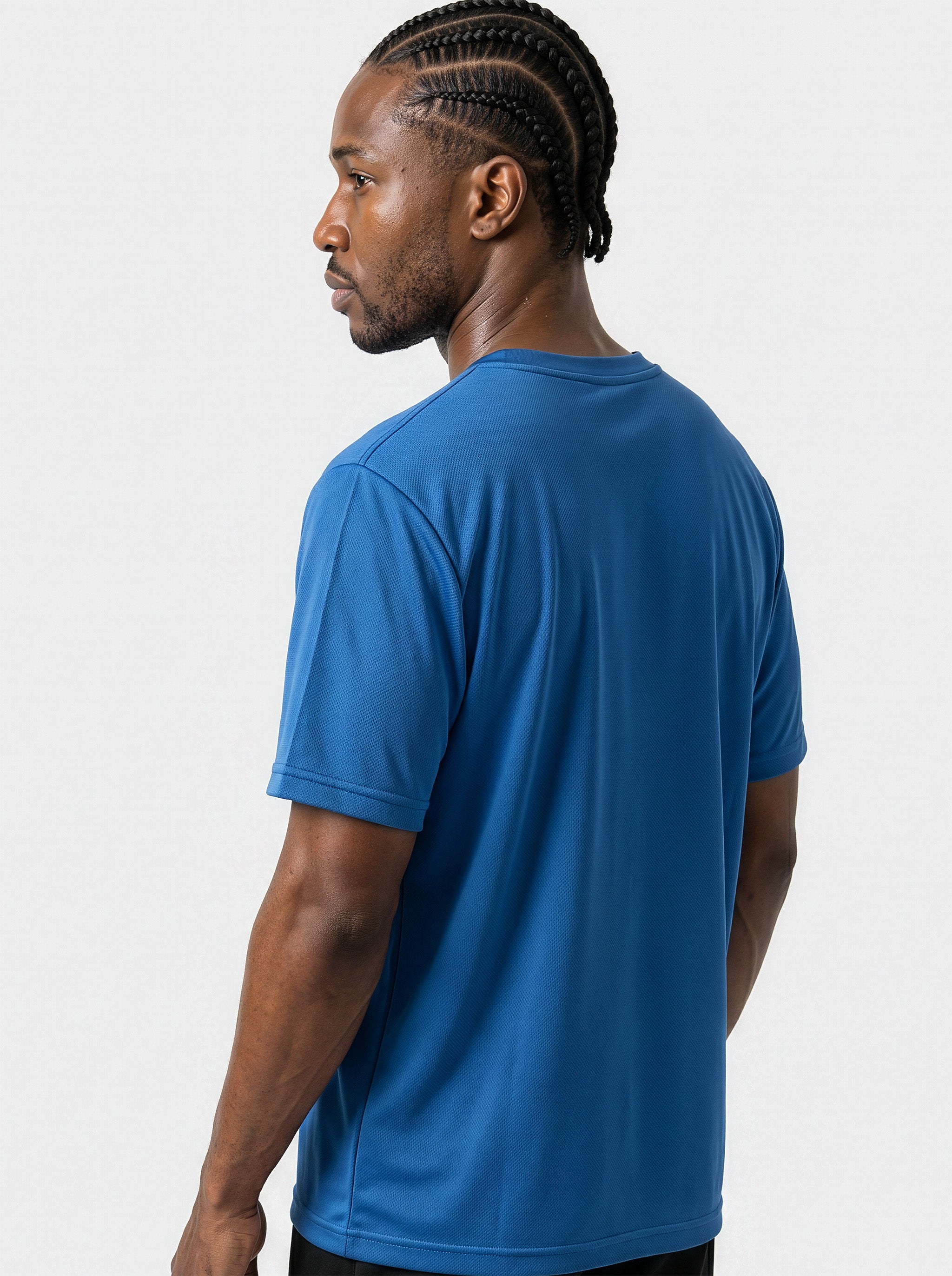 Rear view of the AfroRock Core Performance T-Shirt on model Michael, showcasing the premium athletic fit and back branding details.⁠ 