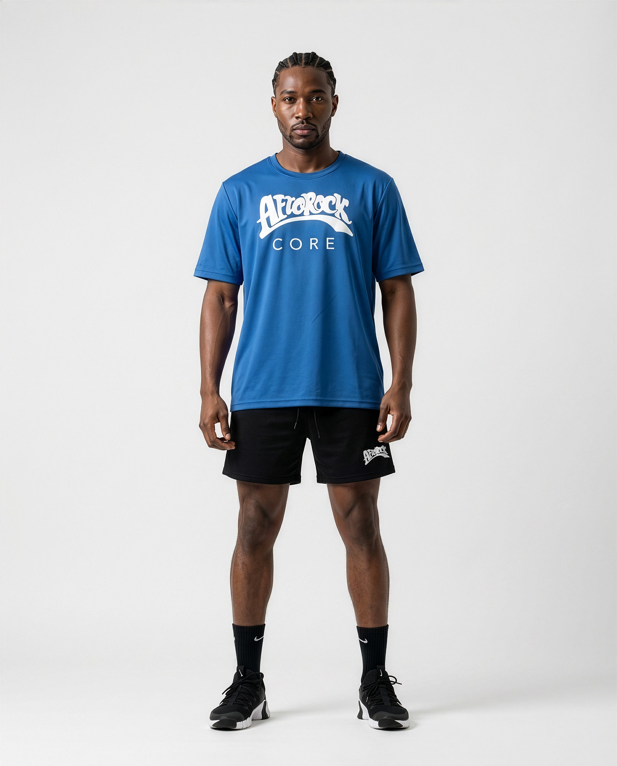 Model Michael wearing the AfroRock Core Performance T-Shirt and Black Activewear Shorts. Premium streetwear-inspire Blue activewear designed for performance and style.⁠