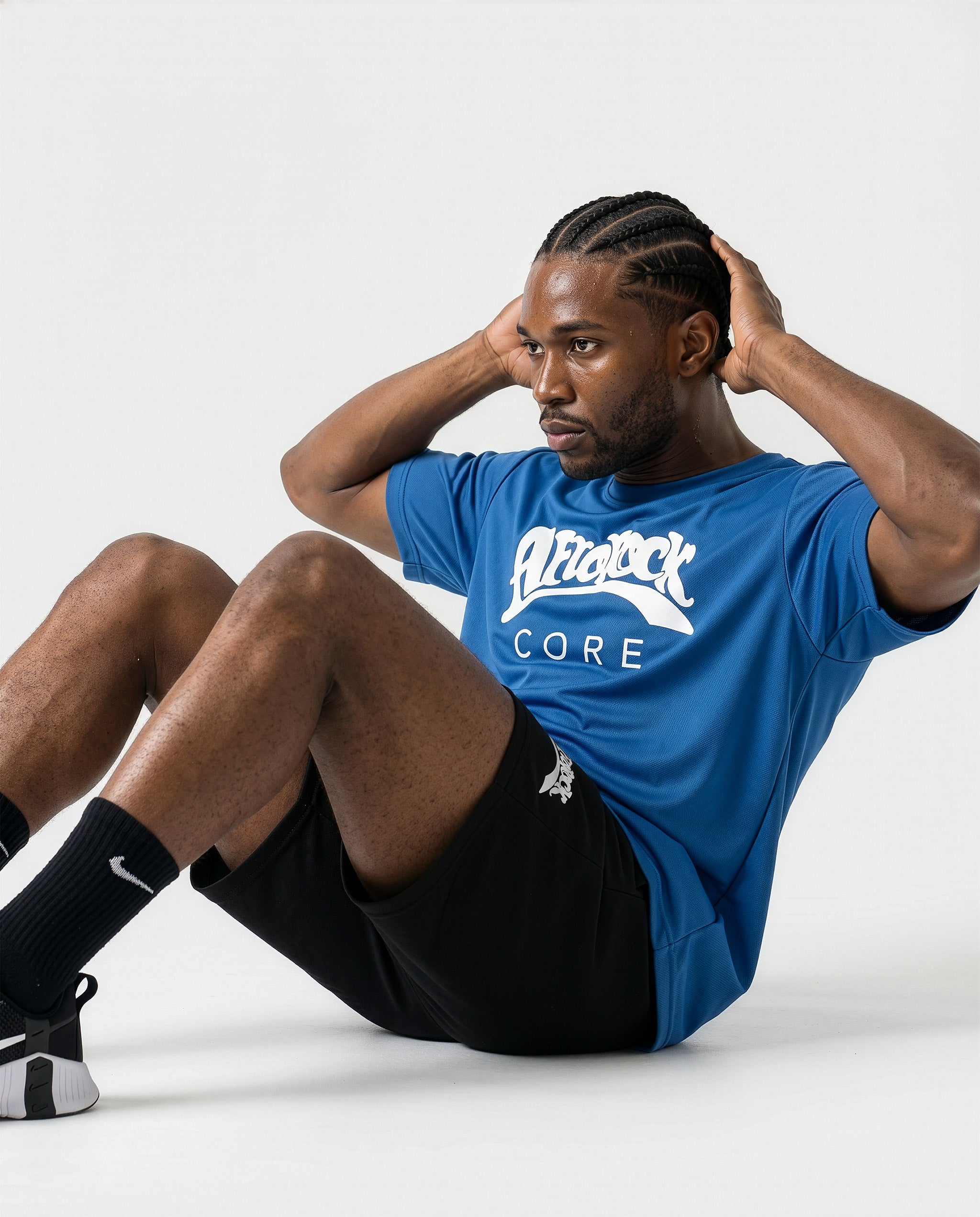 Side view workout of Model Michael wearing the AfroRock Core Performance T-Shirt and Black Activewear Shorts. Premium streetwear-inspire Blue activewear designed for performance and style.⁠
