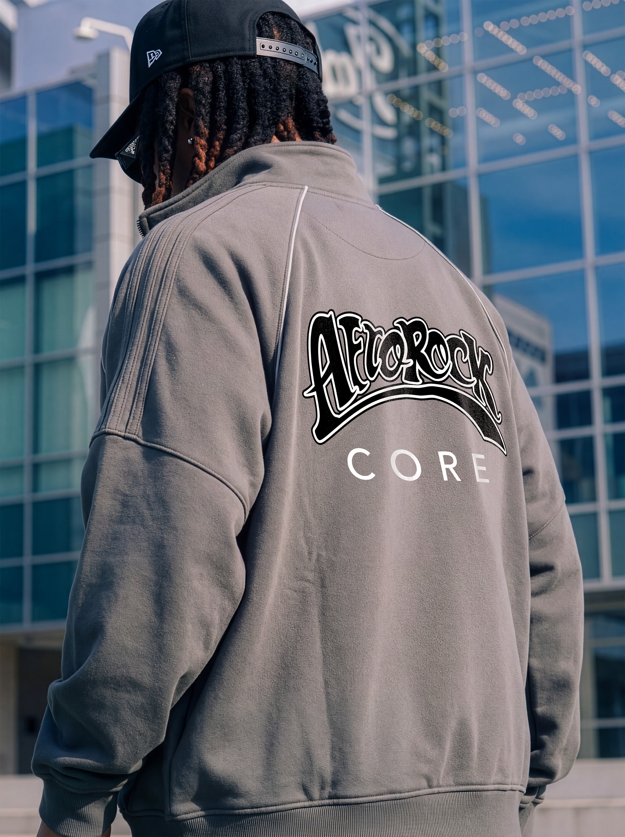 Side Rear view of the AfroRock Core Reflective Striped Jacket gray on Kal Afrorock, showcasing the premium streetwear fit and branding details.⁠ 