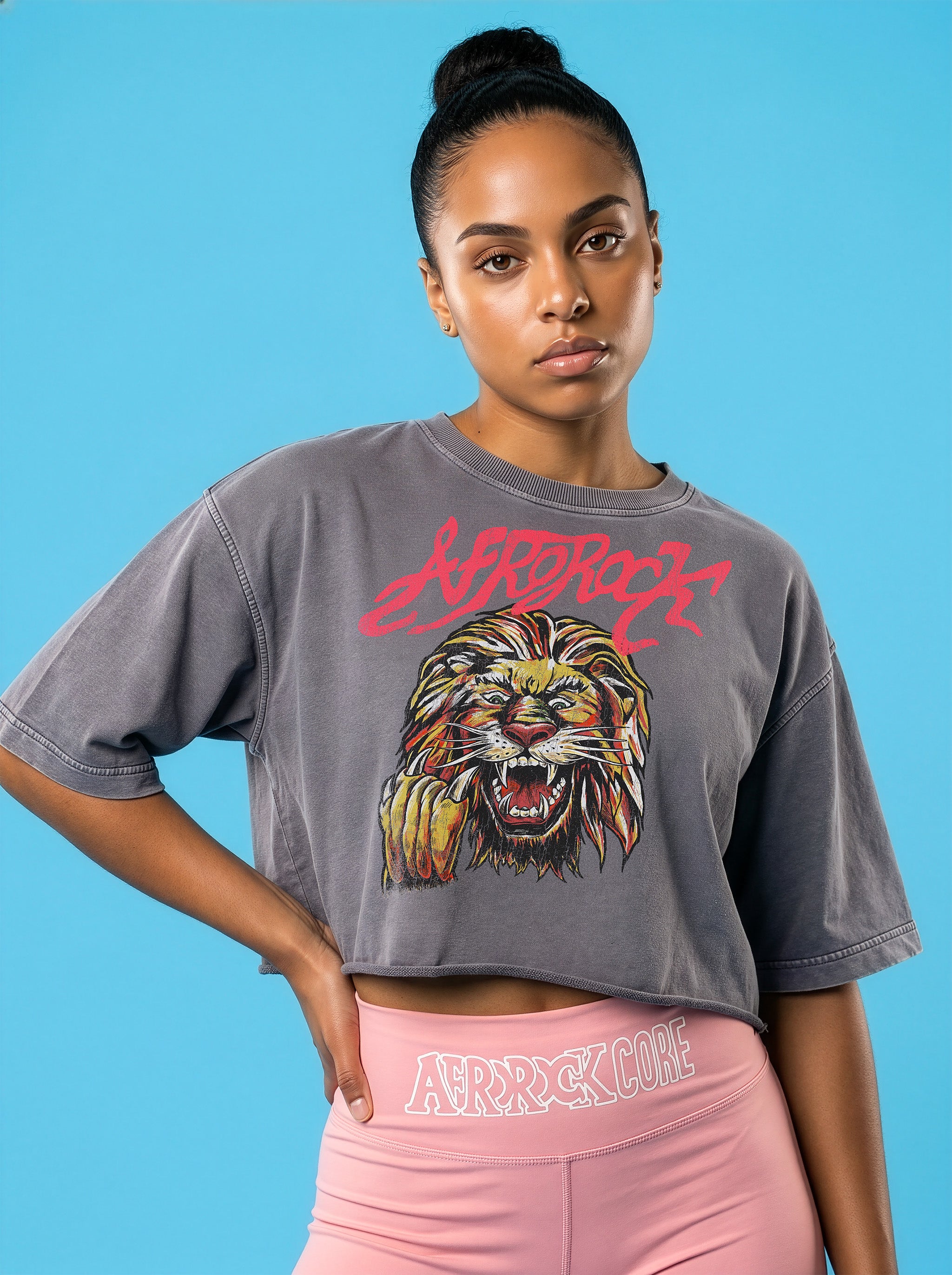 Front view of the AfroRock Ishiagu Washed Raw Edge Gary Crop Top and Pink High-Waisted Biker Shorts on model Kayla, showcasing the premium streetwear fit and branding details.⁠ 