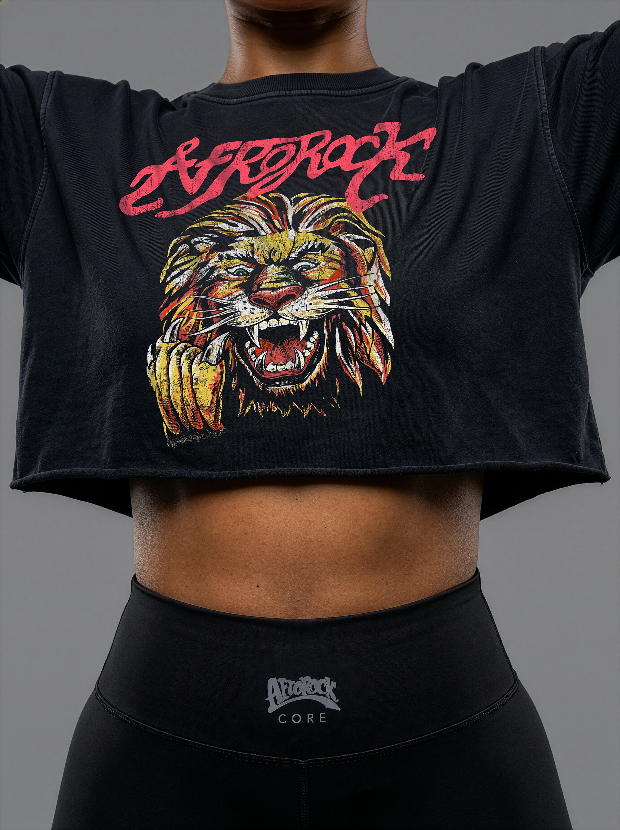 Front detail of the AfroRock Ishiagu Washed Raw Edge Black Crop Top and High-Waisted Biker Shorts on model Nina, showcasing the premium streetwear fit and branding details.⁠ 