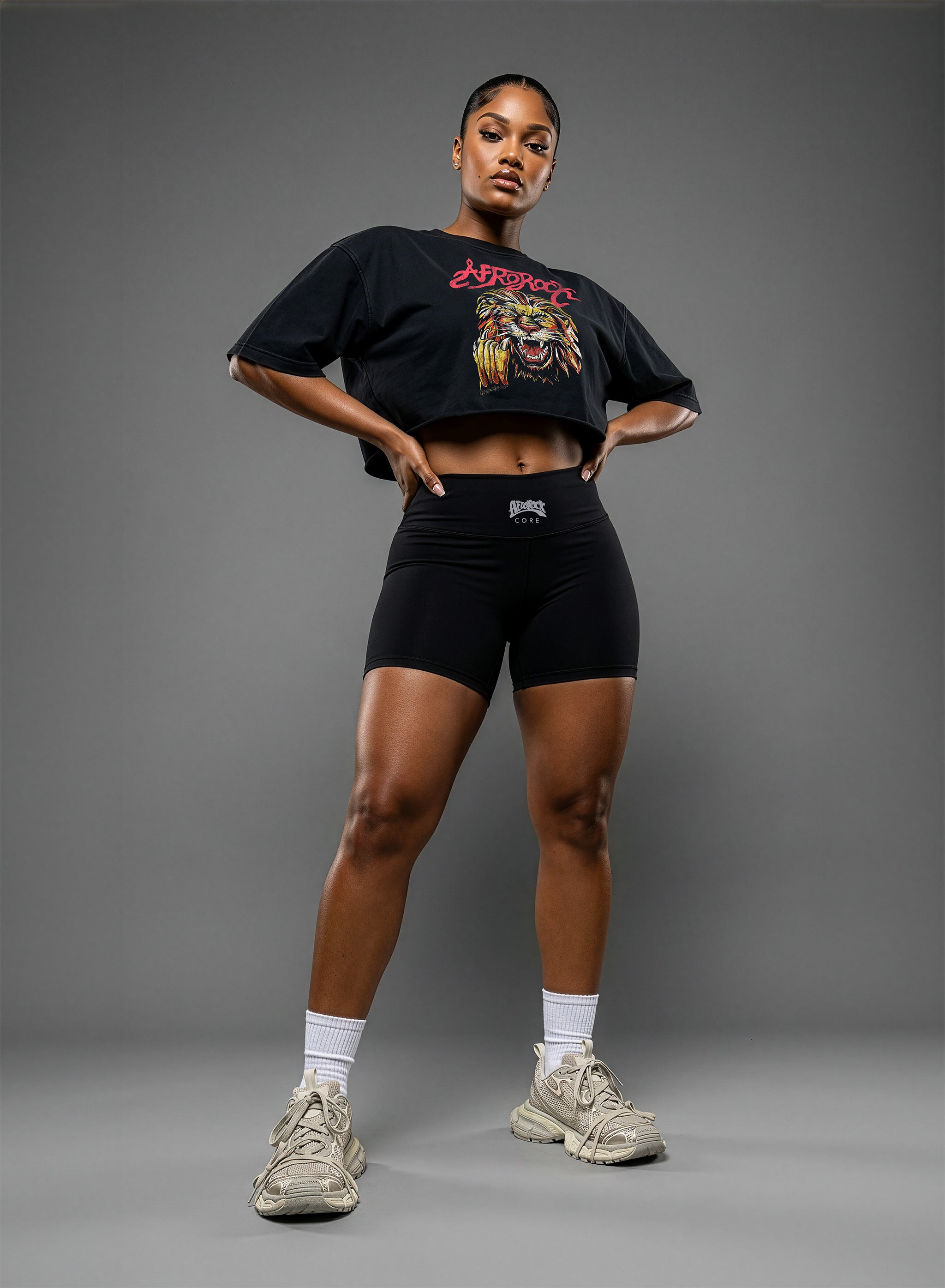 Full Front View of the AfroRock Ishiagu Washed Raw Edge Black Crop Top and High-Waisted Biker Shorts on model Nina, showcasing the premium streetwear fit and branding details.⁠ 