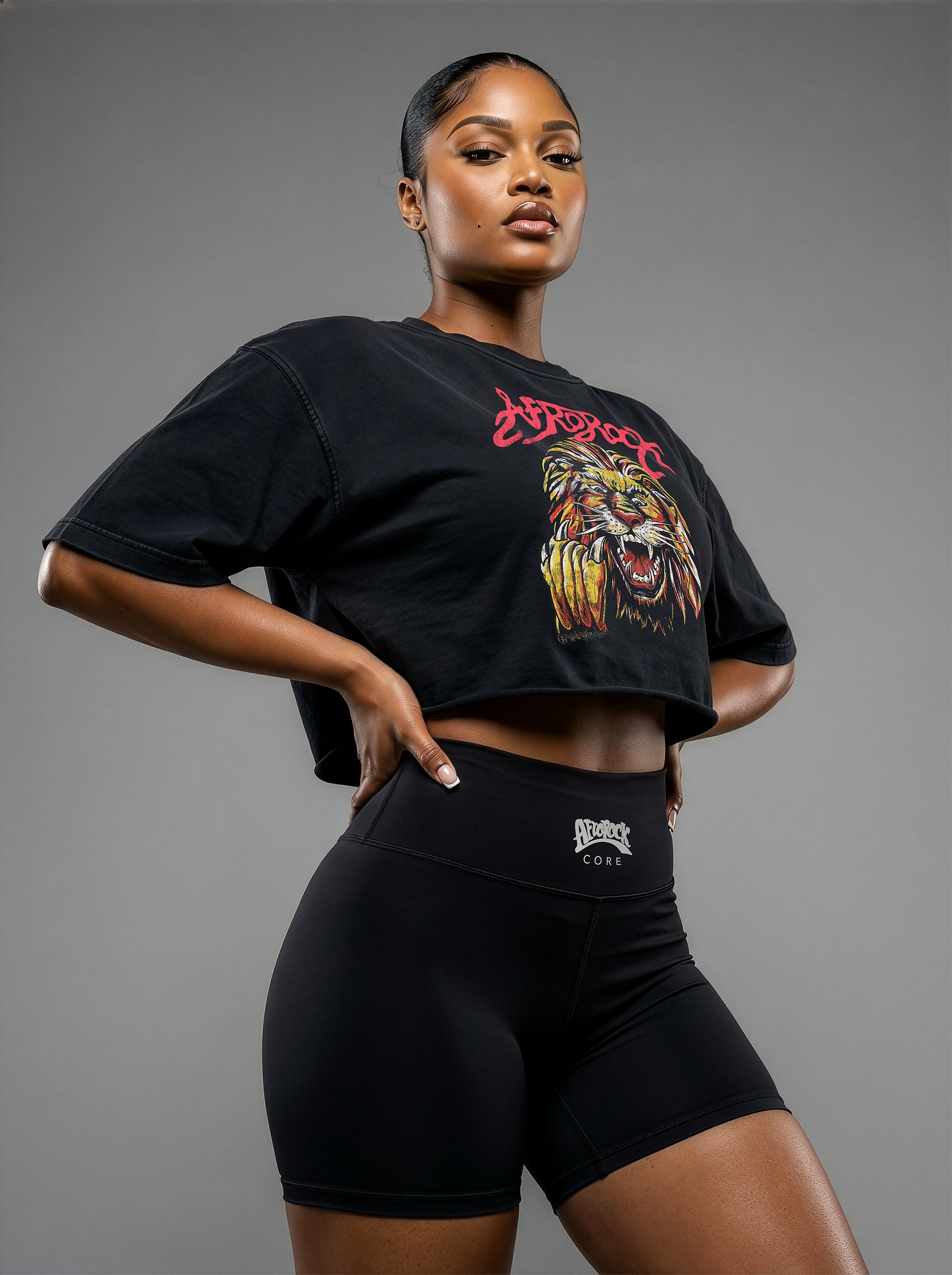 Model Nina wearing the AfroRock Ishiagu Washed Raw Edge Black Crop Top and High-Waisted Biker Shorts on model Nina, showcasing the premium streetwear fit and branding details.⁠ 