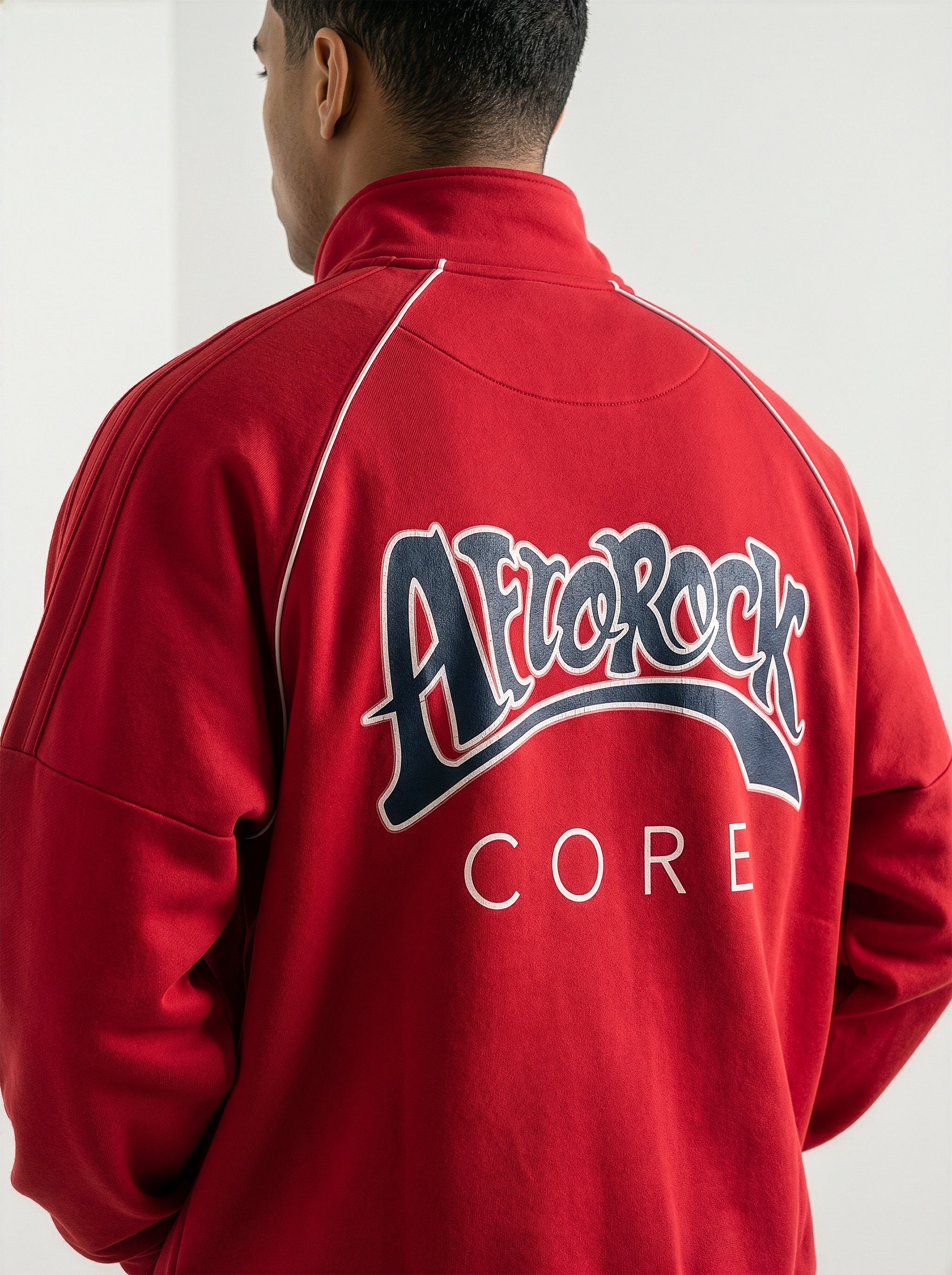 Rear view of the AfroRock Core Reflective Striped Jacket Red Set on model Zach, showcasing the premium streetwear fit and branding details.⁠ 