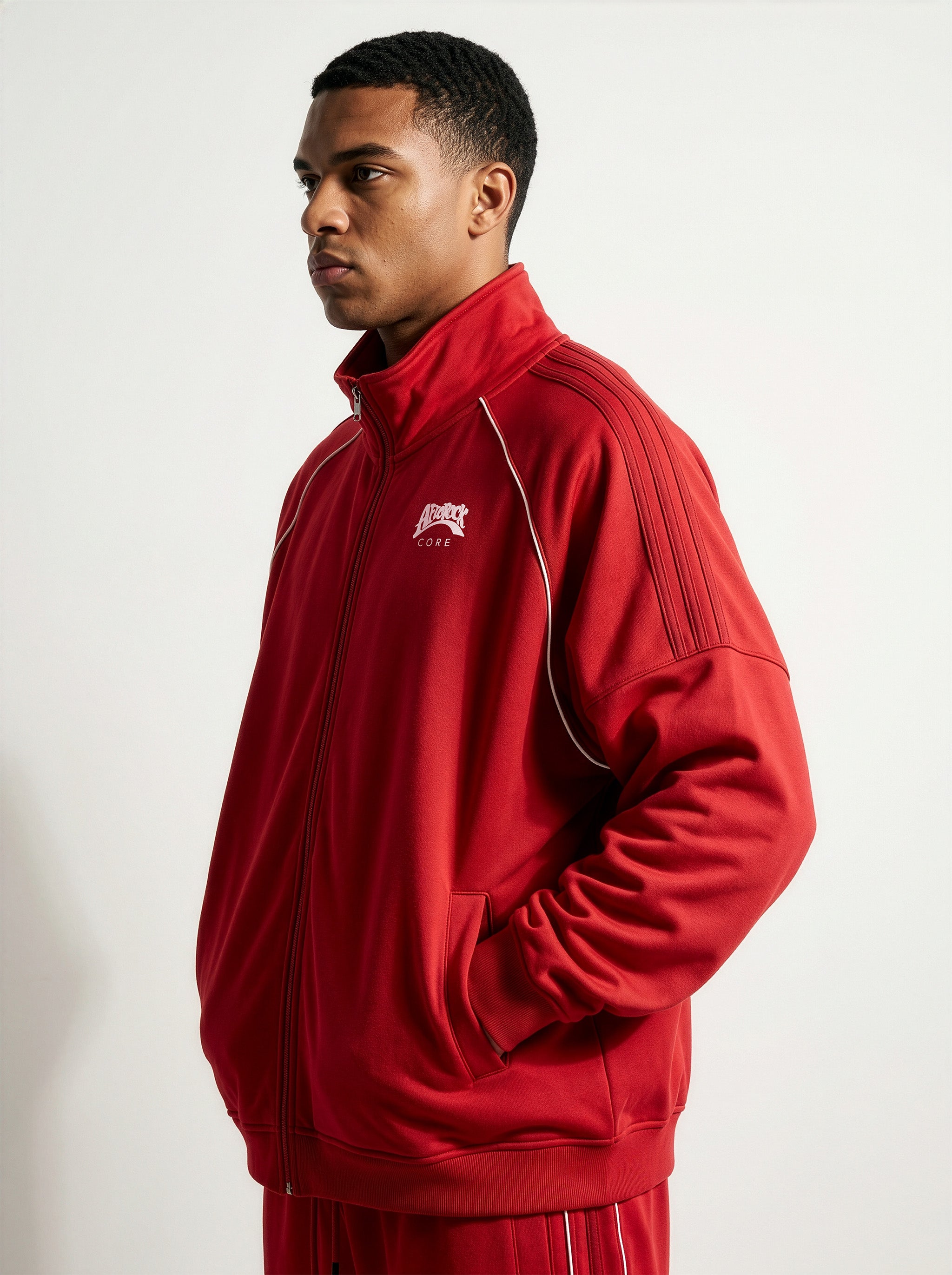 Side view of the AfroRock Core Reflective Striped Jacket Red on model Zach, showcasing the premium streetwear fit and branding details.⁠ 